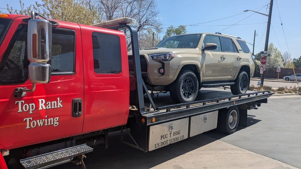 Flatbed towing a Toyota 4Runner